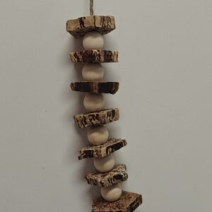 Resident Mahogany parrot toy with sliced mahogany pods and pine beads on seagrass strand with steel c-link
